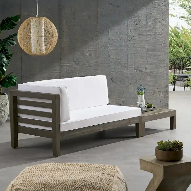 Causeuse d'extérieur Oana en bois d'acacia avec accoudoir gauche et table basse avec coussin par Christopher Knight Home