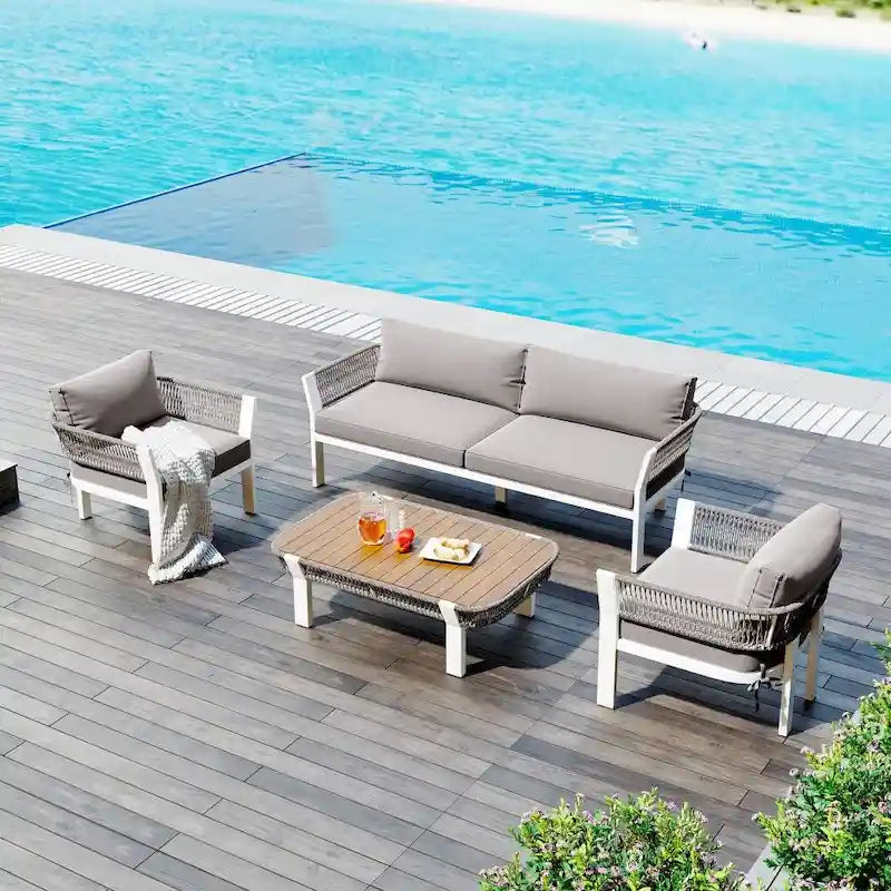 Ensemble de conversation d'extérieur 4 pièces avec table basse et coussins moelleux