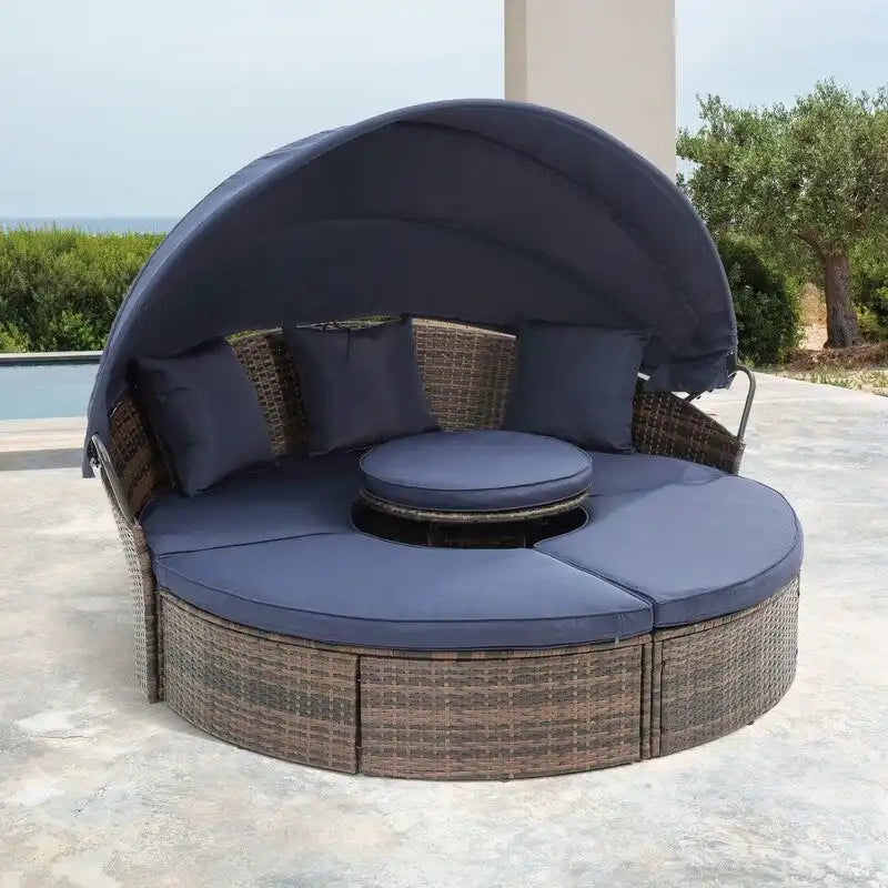 Lit de repos rond d'extérieur en rotin avec auvent, table basse