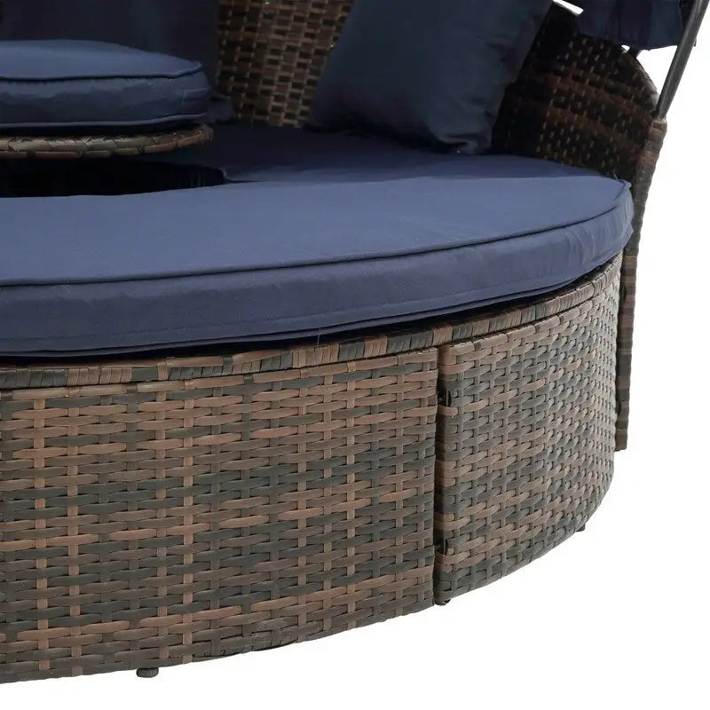 Lit de repos rond d'extérieur en rotin avec auvent, table basse