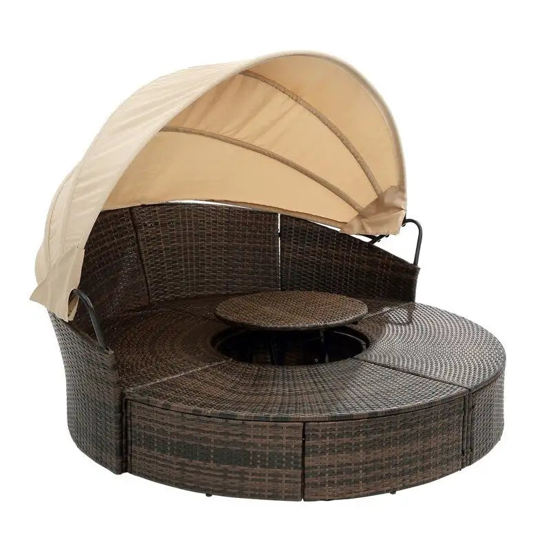Lit de repos rond d'extérieur en rotin avec auvent, table basse