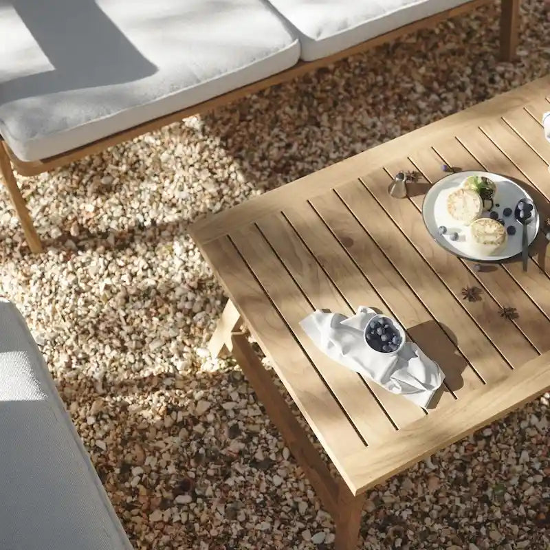 Salon de jardin en bois d'acacia, table basse et banquette avec coussins