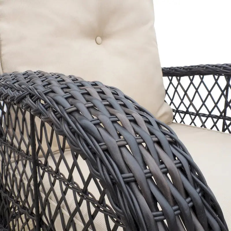 Fauteuil à bascule d'extérieur en rotin avec coussin et cadre en métal thermolaqué